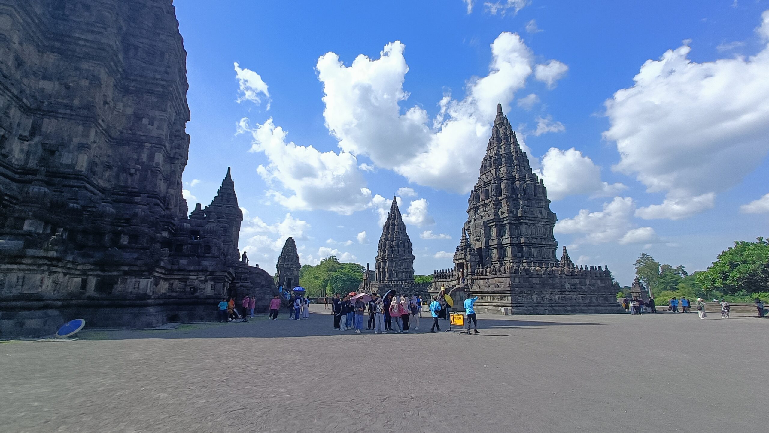 Prambanan Temple: The 00:00 Guide to Java’s Hindu Twin Three main temples of Prambanan complex with tourists and blue sky in Yogyakarta Indonesia Trimurti Shiva Vishnu Brahma