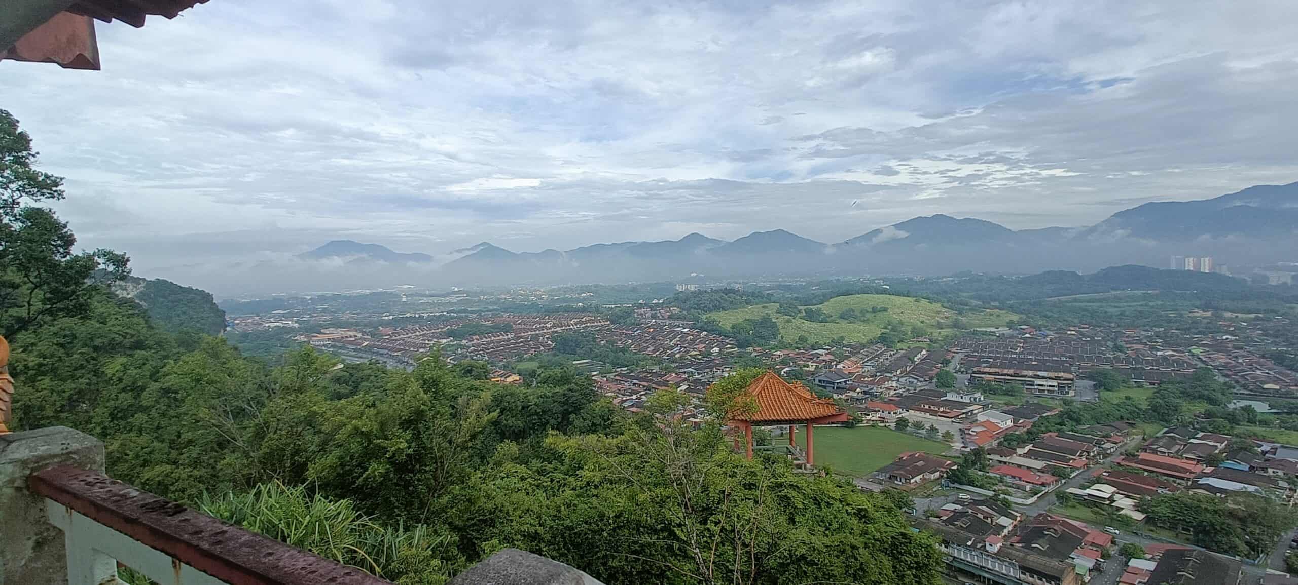 Panoramic mountain and city view from Perak Tong Cave Temple cliff in Ipoh