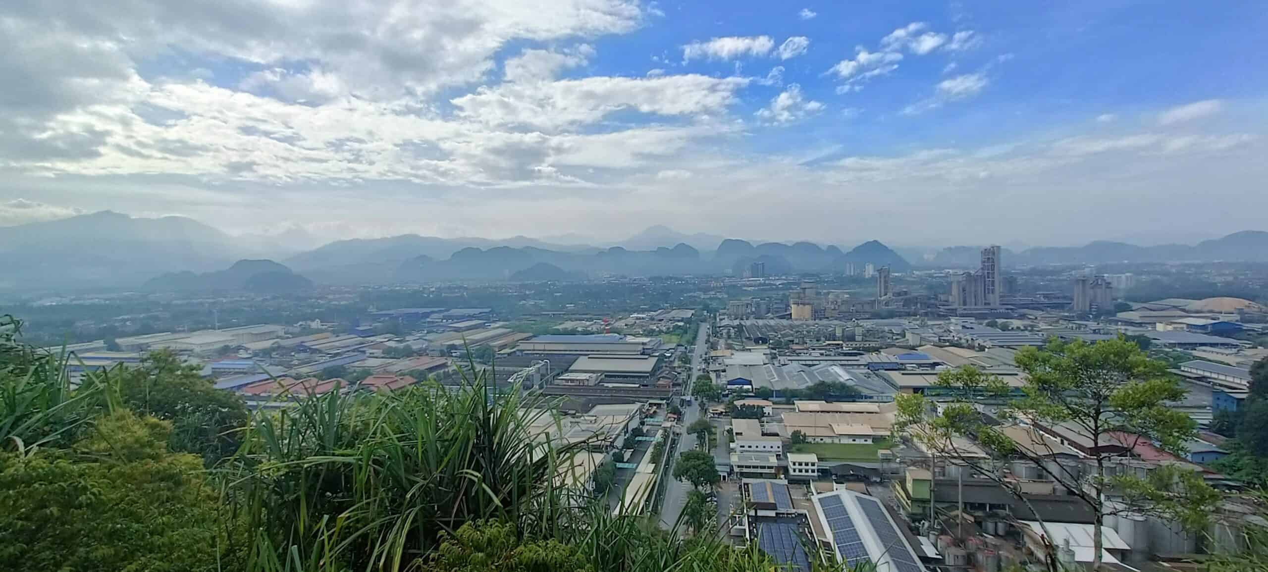 Aerial view of Ipoh city, buildings and mountains from Perak Tong Cave Temple